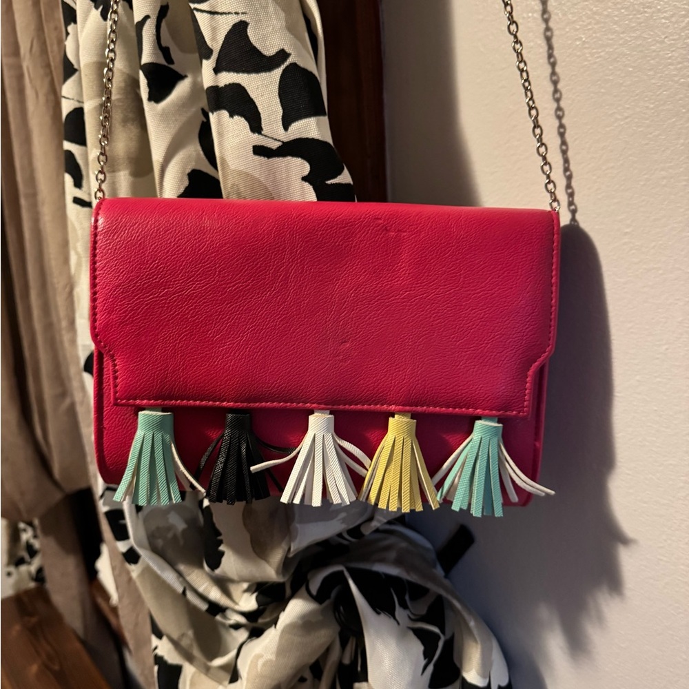 This cute small pink crossbody with different color decorative tassels